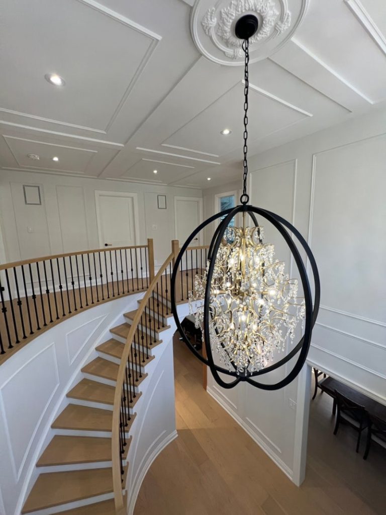 283 Hidden Trail — Grand curved staircase with crystal chandelier